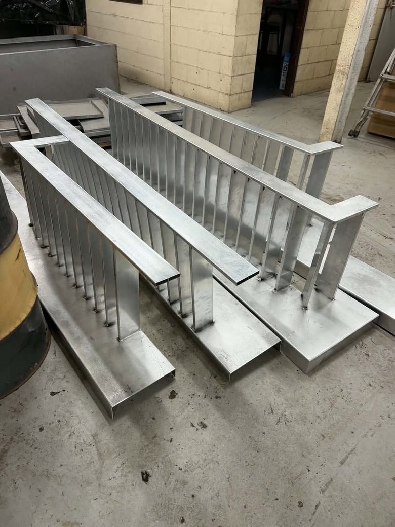 Custom balustrade panels fabricated and finished on the workshop floor, ready for install.